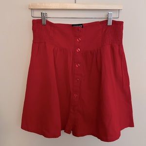 Topshop red button front skirt.